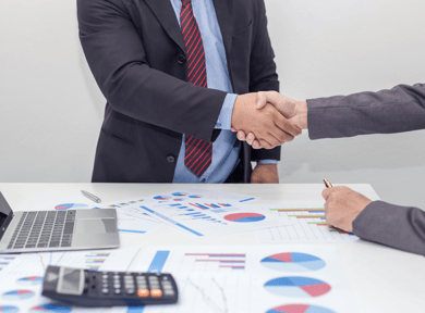 People shaking hands on a deal