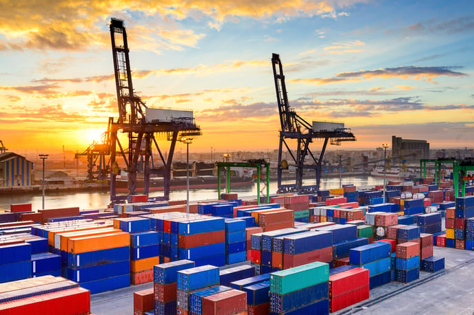 Industrial port at dawn with colourful containers